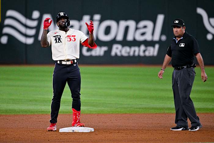 Texas Rangers right fielder Adolis Garcia celebrates a double against the Los Angeles Dodgers in the fourth inning Friday at Globe Life Field.